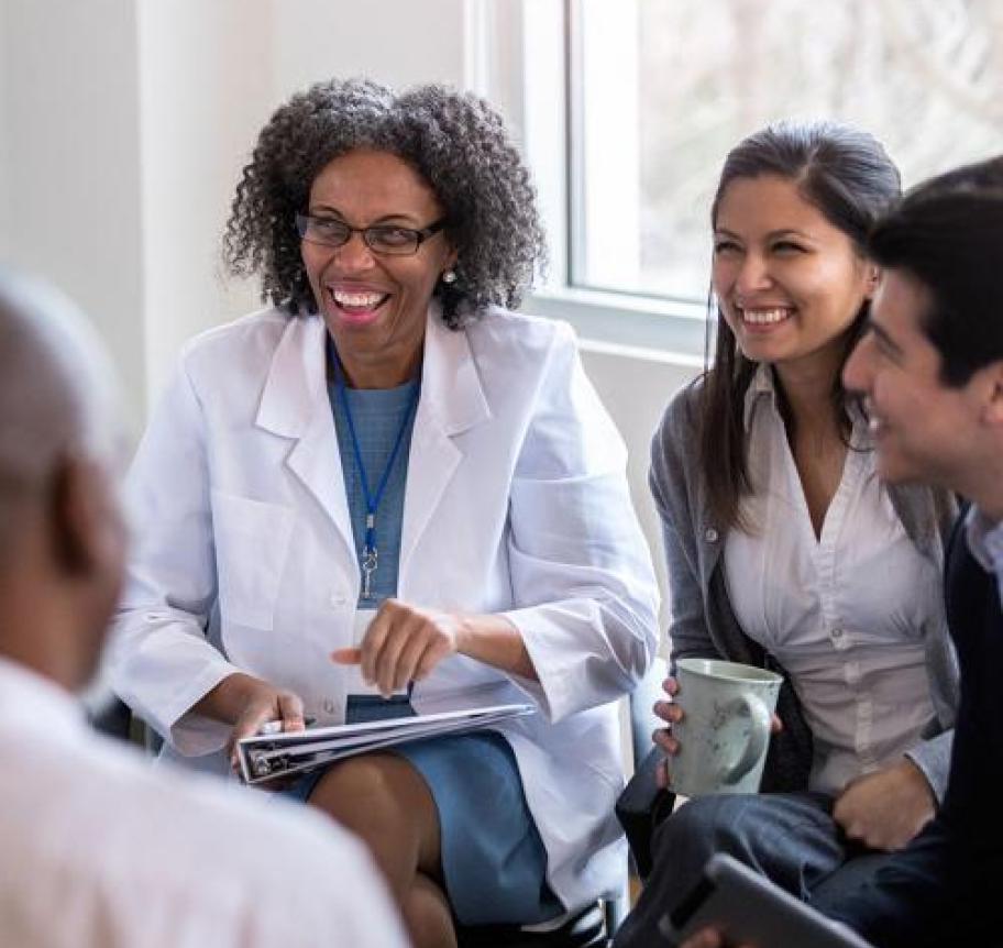 Healthcare professionals sitting in a group while talking