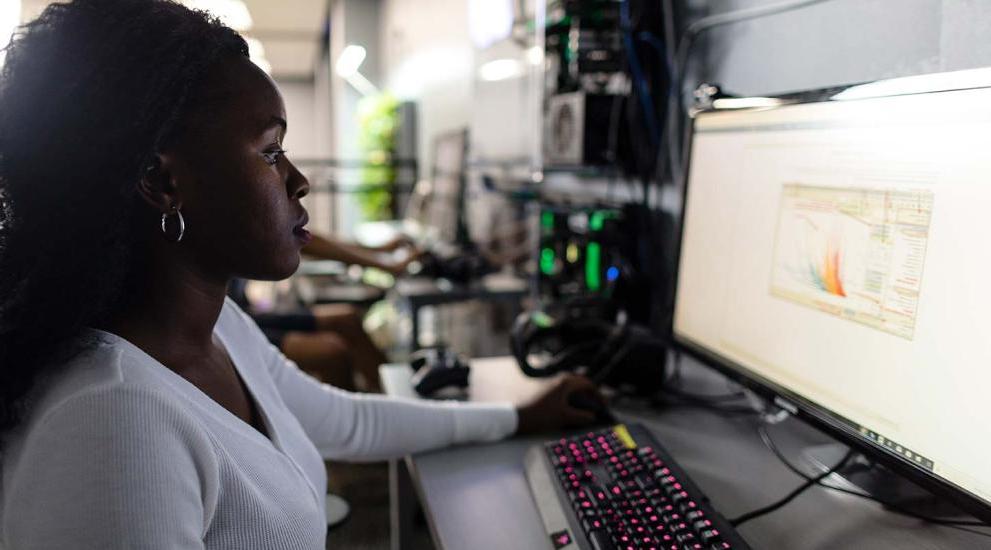 Student working at computer in Radlab